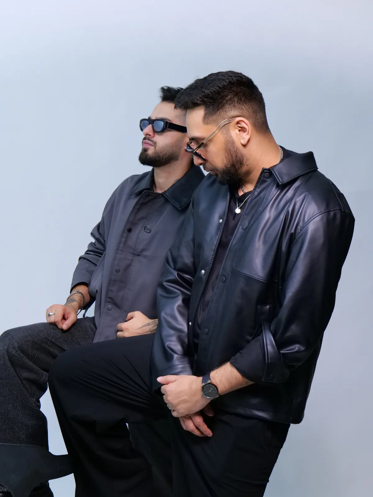 Studio portrait in dark jackets